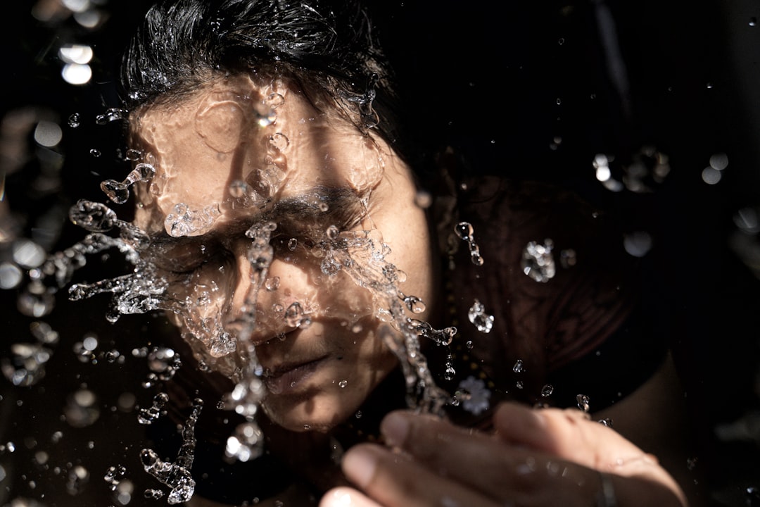 Woman washing and cleansing her face