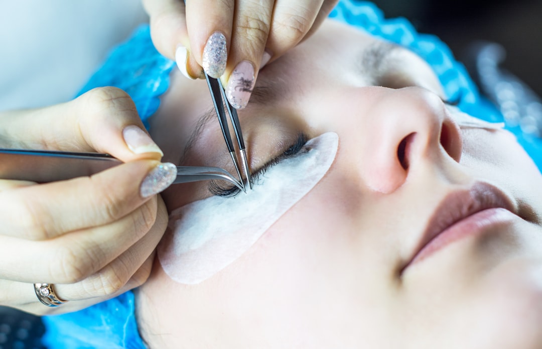 Close-up of false lash application on the eye