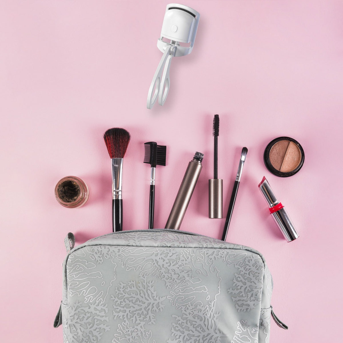 GlowCurl heated eyelash curler with makeup bag for a daily routine
